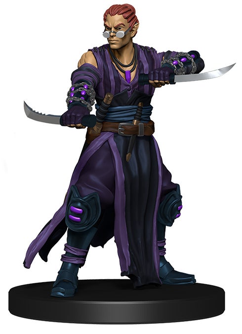 promo mini figure of a half elf with his hair pulled back, wearing dark purple and black robes with two knives held out horizontally 